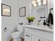 Updated half bathroom featuring modern fixtures, stylish decor, and a bright aesthetic at 4650 S Idalia St, Aurora, CO 80015