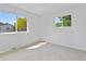 Bright bedroom with large windows, plush carpet, and ample natural light at 4650 S Idalia St, Aurora, CO 80015