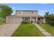 Charming two-story home with a well-maintained lawn and three-car garage at 4650 S Idalia St, Aurora, CO 80015