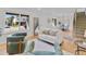 Open-concept living room with hardwood floors, staircase, and dining area at 4650 S Idalia St, Aurora, CO 80015