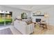 Cozy living room featuring a fireplace, hardwood floors, and patio access at 4650 S Idalia St, Aurora, CO 80015