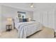 Bright main bedroom showcasing ample natural light, ceiling fan, and stylish decor at 4650 S Idalia St, Aurora, CO 80015