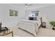 Bright main bedroom showcasing ample natural light, ceiling fan, and stylish decor at 4650 S Idalia St, Aurora, CO 80015