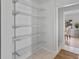 Walk-in pantry with shelving, offering ample storage and organization space at 4650 S Idalia St, Aurora, CO 80015