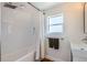 Clean and bright bathroom with subway tile, a modern sink, and a shower-tub combination at 4648 Josephine St, Denver, CO 80216
