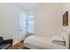 Cozy bedroom with white walls, hardwood floors, and a comfortable twin bed at 4648 Josephine St, Denver, CO 80216