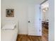 Bright bedroom featuring hardwood floors and a doorway leading to a dining area at 4648 Josephine St, Denver, CO 80216