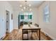 Comfortable dining room featuring hardwood floors, a dining table, and a view into the modern kitchen at 4648 Josephine St, Denver, CO 80216