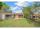 Backyard with mature trees and detached garage at 1330 Oak Pl, Thornton, CO 80229