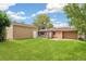 Backyard with mature trees and detached garage at 1330 Oak Pl, Thornton, CO 80229