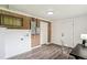Basement with hardwood style floors, exposed brick, and laundry hookups at 1330 Oak Pl, Thornton, CO 80229
