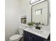 Bathroom with modern vanity, paint, and fixtures at 1330 Oak Pl, Thornton, CO 80229