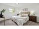 Inviting bedroom with plush bedding and neutral tones, creating a serene retreat for rest and relaxation at 1330 Oak Pl, Thornton, CO 80229