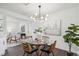 Inviting dining area with stylish lighting and an open layout that flows seamlessly into the modern living space at 1330 Oak Pl, Thornton, CO 80229
