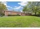 Charming brick home with lush front lawn and mature trees, offering a welcoming curb appeal and a serene neighborhood setting at 1330 Oak Pl, Thornton, CO 80229
