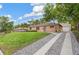 Exterior of house with a driveway and grass at 1330 Oak Pl, Thornton, CO 80229