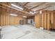 Large, unfinished garage space with exposed ceiling beams and a concrete floor, suitable for customization and various uses at 1330 Oak Pl, Thornton, CO 80229