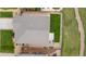 Aerial view of the property highlighting the roof, backyard, and patio at 848 Sagebrush Dr, Brighton, CO 80603