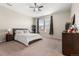 Spacious main bedroom with carpet, natural light, and neutral color scheme at 848 Sagebrush Dr, Brighton, CO 80603
