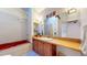 Bathroom featuring a red soaking tub and vanity with wood countertop at 2602 Hidden Valley Road, Sedalia, CO 80135