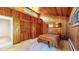 Wood paneled bedroom with mountain views and built-in storage at 2602 Hidden Valley Road, Sedalia, CO 80135