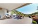 Spacious deck featuring a hot tub, outdoor dining area, fireplace and scenic mountain views at 2602 Hidden Valley Road, Sedalia, CO 80135
