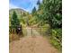 Gated driveway leading to the property, offering privacy and seclusion at 2602 Hidden Valley Road, Sedalia, CO 80135
