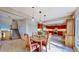 Charming kitchen with cherry cabinets, adjacent to a dining area with an adjacent staircase at 2602 Hidden Valley Road, Sedalia, CO 80135