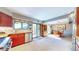 Spacious kitchen and dining area with outdoor views and natural light at 2602 Hidden Valley Road, Sedalia, CO 80135