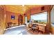 Wood paneled home office with mountain views, built-in shelves, and desk at 2602 Hidden Valley Road, Sedalia, CO 80135