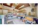 Organized workshop featuring ample shelving and a functional work bench for various projects at 2602 Hidden Valley Road, Sedalia, CO 80135