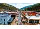 High angle view of the town's main street, displaying businesses and mountain scenery at 1520 Virginia St, Idaho Springs, CO 80452