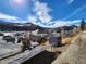 Overhead view of houses with solar panels, set against a backdrop of mountains at 1520 Virginia St, Idaho Springs, CO 80452