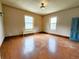 Room with wood floors, two windows and vintage light at 1520 Virginia St, Idaho Springs, CO 80452