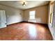 Room with two windows and vintage light fixture at 1520 Virginia St, Idaho Springs, CO 80452