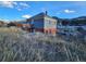Two-story home boasts a brick foundation, wood siding, and mountain views at 1520 Virginia St, Idaho Springs, CO 80452