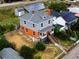 Two-story home boasts a new roof, solar panels, gray siding, and a brick foundation at 1520 Virginia St, Idaho Springs, CO 80452