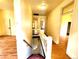 Hallway with wood floors and staircase leading up to the living area at 1520 Virginia St, Idaho Springs, CO 80452