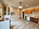 This kitchen features light gray wood flooring, built-in cabinets, and stainless steel appliances at 1520 Virginia St, Idaho Springs, CO 80452