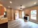 This eat-in kitchen has lots of natural light, a vintage-style stove, and light gray wood flooring at 1520 Virginia St, Idaho Springs, CO 80452