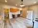 Open kitchen featuring light gray wood flooring, stainless steel appliances, and plenty of natural light at 1520 Virginia St, Idaho Springs, CO 80452