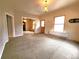 Open living room with entry door and decorative vintage fixtures at 1520 Virginia St, Idaho Springs, CO 80452