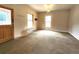 Large living room with vintage light fixture and multiple windows at 1520 Virginia St, Idaho Springs, CO 80452