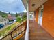 Porch view of brick home near downtown with mountain views from a second story porch at 1520 Virginia St, Idaho Springs, CO 80452