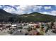 Scenic view of a town nestled in a valley, surrounded by mountains and forests at 1520 Virginia St, Idaho Springs, CO 80452