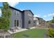 Beautiful backyard with artificial turf, hardscape, landscaping, and a basketball hoop for outdoor enjoyment at 9836 Banner Peak St, Littleton, CO 80125