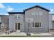 Picture of a backyard with artificial turf, landscaping, hardscape, a basketball hoop, and a nice patio at 9836 Banner Peak St, Littleton, CO 80125