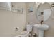 Cozy half bathroom featuring modern fixtures, stylish decor, and ample lighting at 9836 Banner Peak St, Littleton, CO 80125