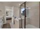 Bright bathroom featuring soaking tub with tile surround and glass enclosed walk in shower at 9836 Banner Peak St, Littleton, CO 80125
