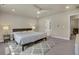 Well-lit bedroom with plush carpet, offering a peaceful and inviting personal space at 9836 Banner Peak St, Littleton, CO 80125